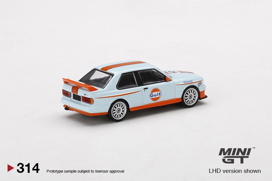 1/64 Mini GT #314 Mijo Exclusives World Wide BMW M3 E30 Gulf Livery Limited Edition mgt00314